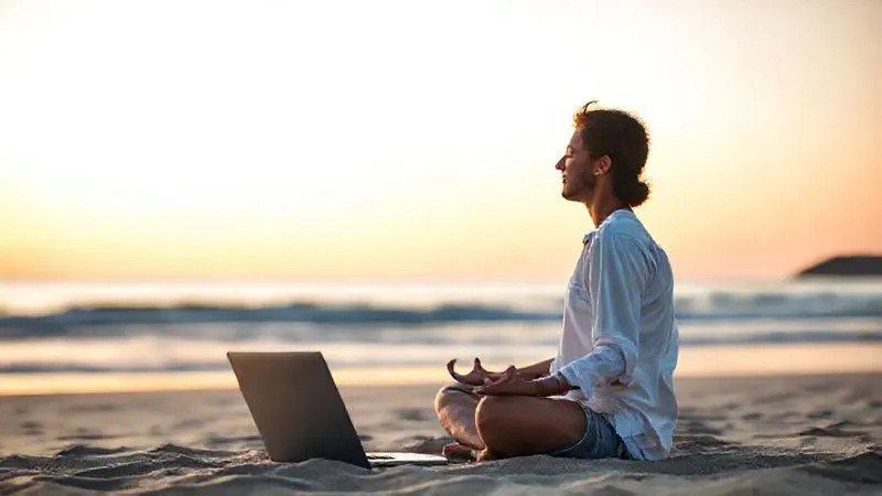 A photorealistic image of a digital nomad meditating peacefully on a tranquil beach at sunrise, with a laptop closed beside them, symbolizing work-life balance and mental well-being amidst travel. The focus is on the serenity of the moment, with the ocean in the background. Cinematic lighting, 8K hyper-detailed, depth of field, shot on a high-end DSLR.