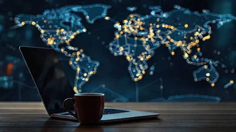 Photorealistic image of a world map with glowing lines connecting different cities, representing global online networking, with a laptop and coffee cup in the foreground, professional photography, 8K, cinematic lighting, sharp focus, depth of field, shot on a high-end DSLR.
