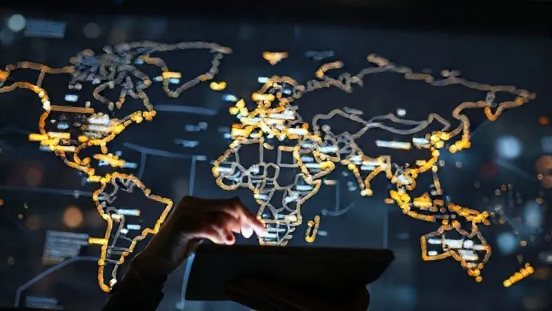 A photorealistic world map with glowing lines connecting different cities, each city displaying its current local time. A focused digital nomad is looking at this map on a tablet, a thoughtful expression on their face. Cinematic lighting, sharp focus on the map and person, depth of field blurring the background, 8K hyper-detailed, professional photography, shot on a high-end DSLR.
